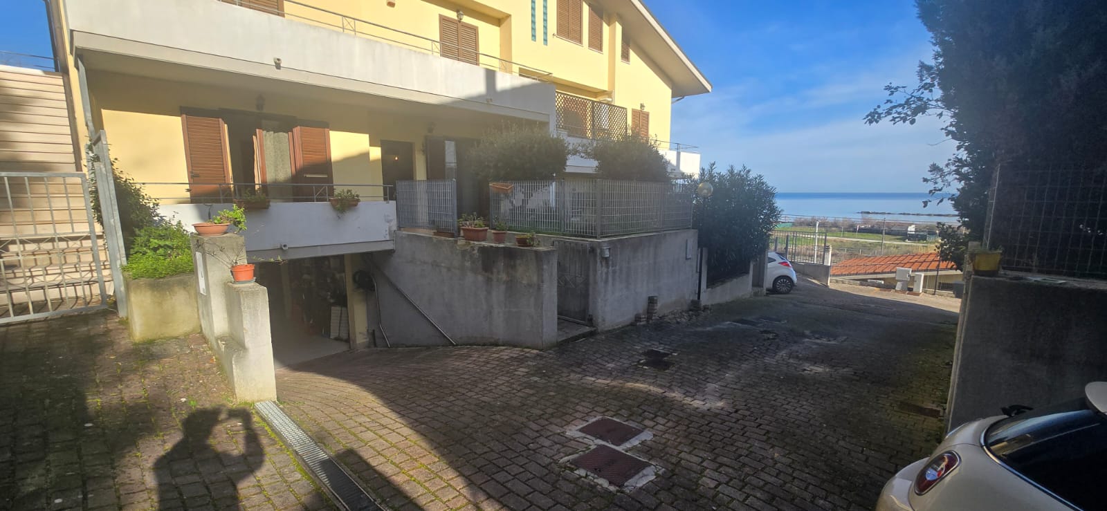 A terraced house just off the sea.