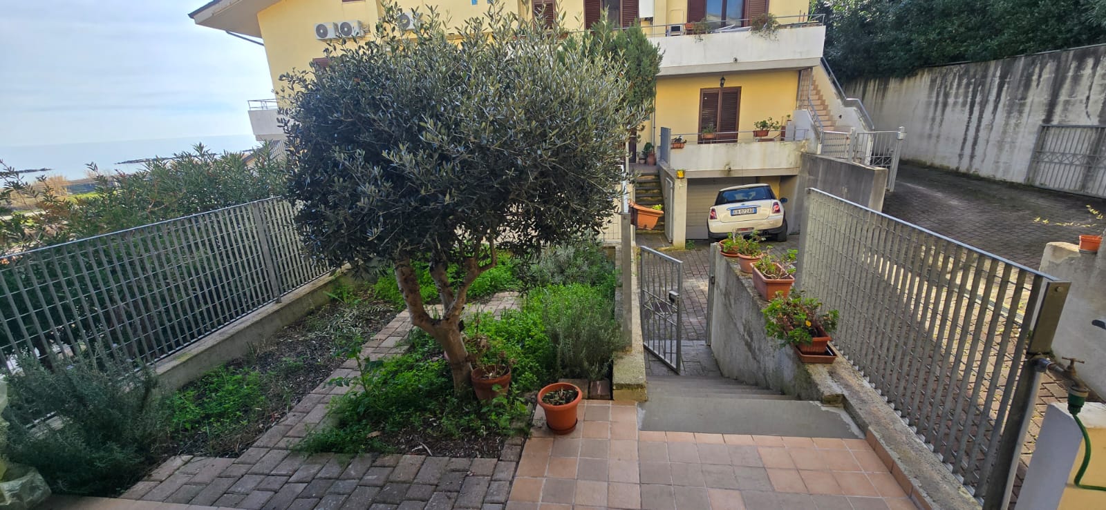 A terraced house just off the sea.
