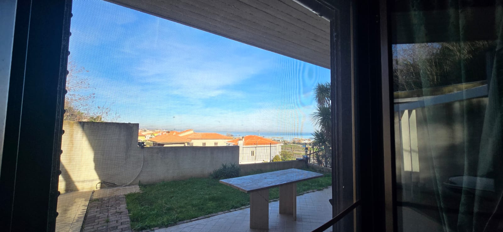 A terraced house just off the sea.