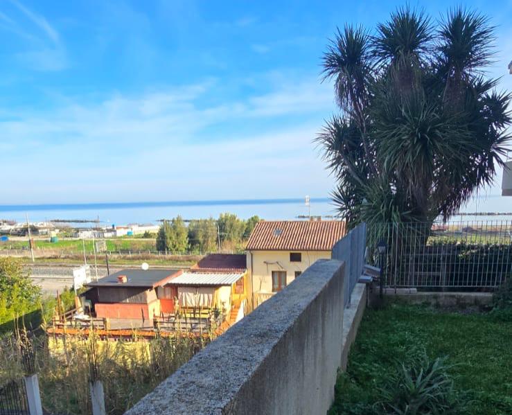 A terraced house just off the sea.