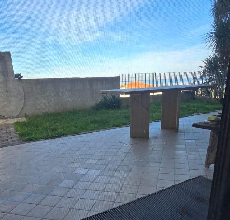 A terraced house just off the sea.