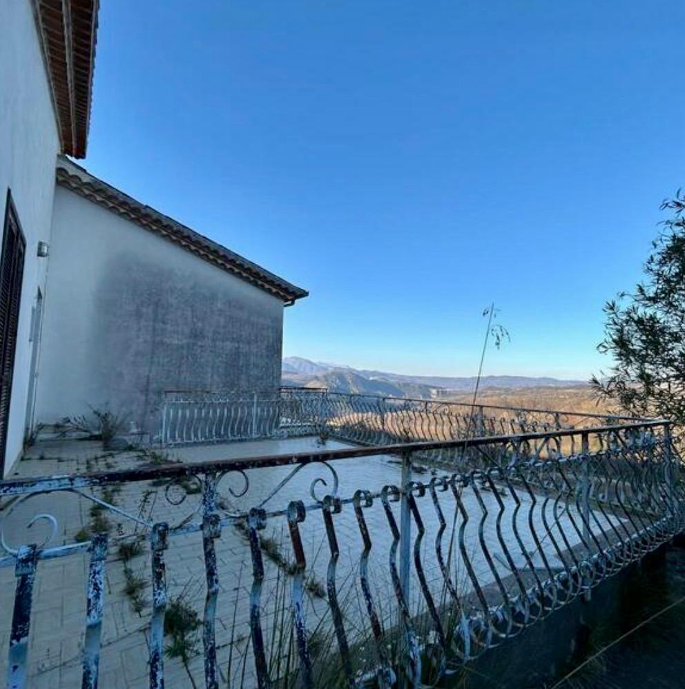 Freehold villa surrounded by greenery.