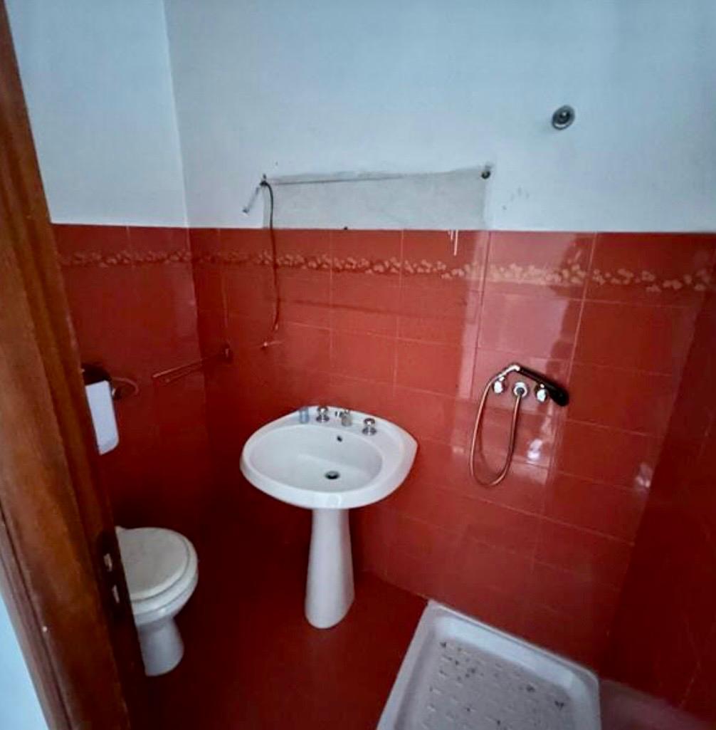 Freehold villa surrounded by greenery.