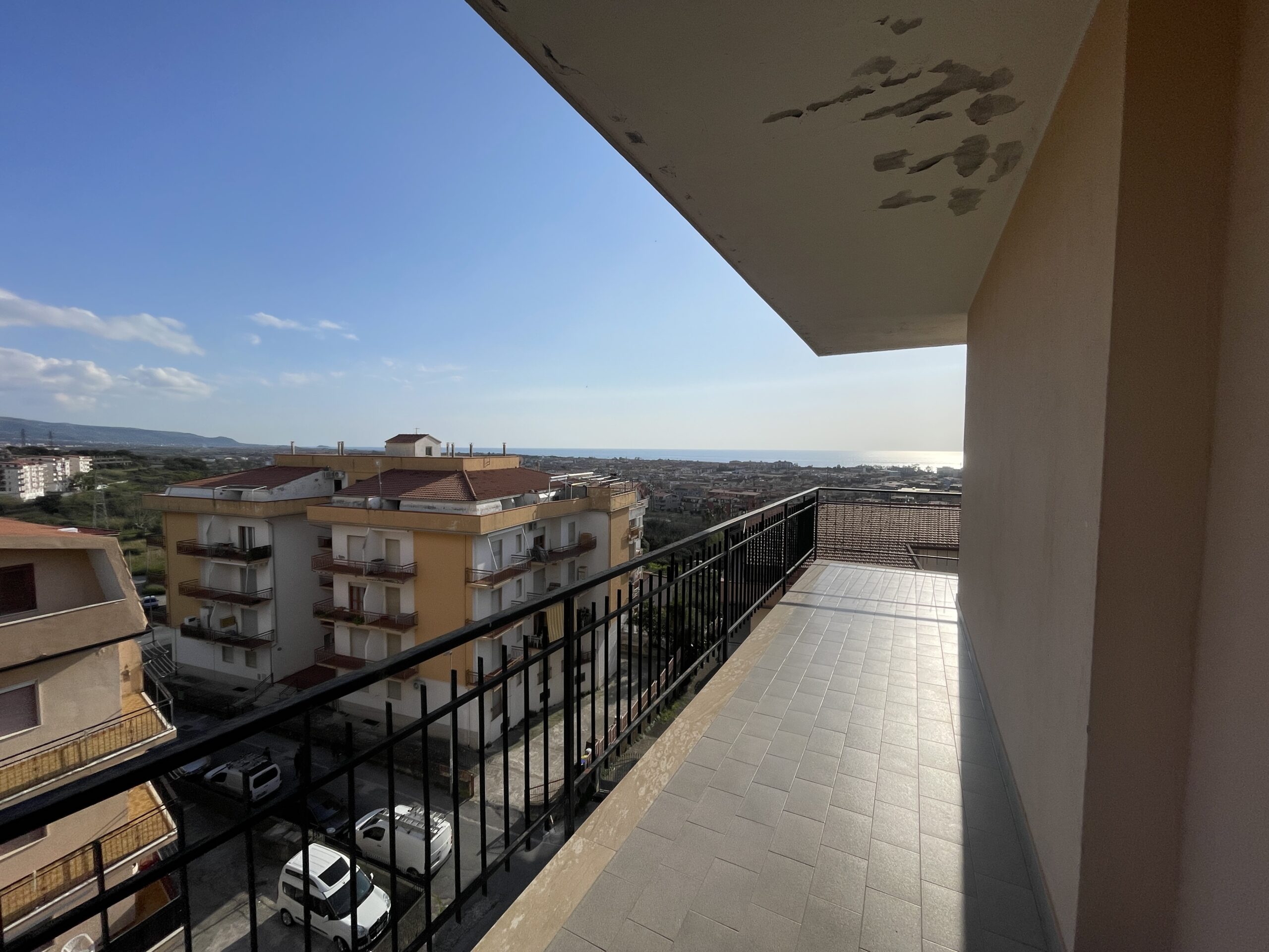 A flat with large panoramic balcony.
