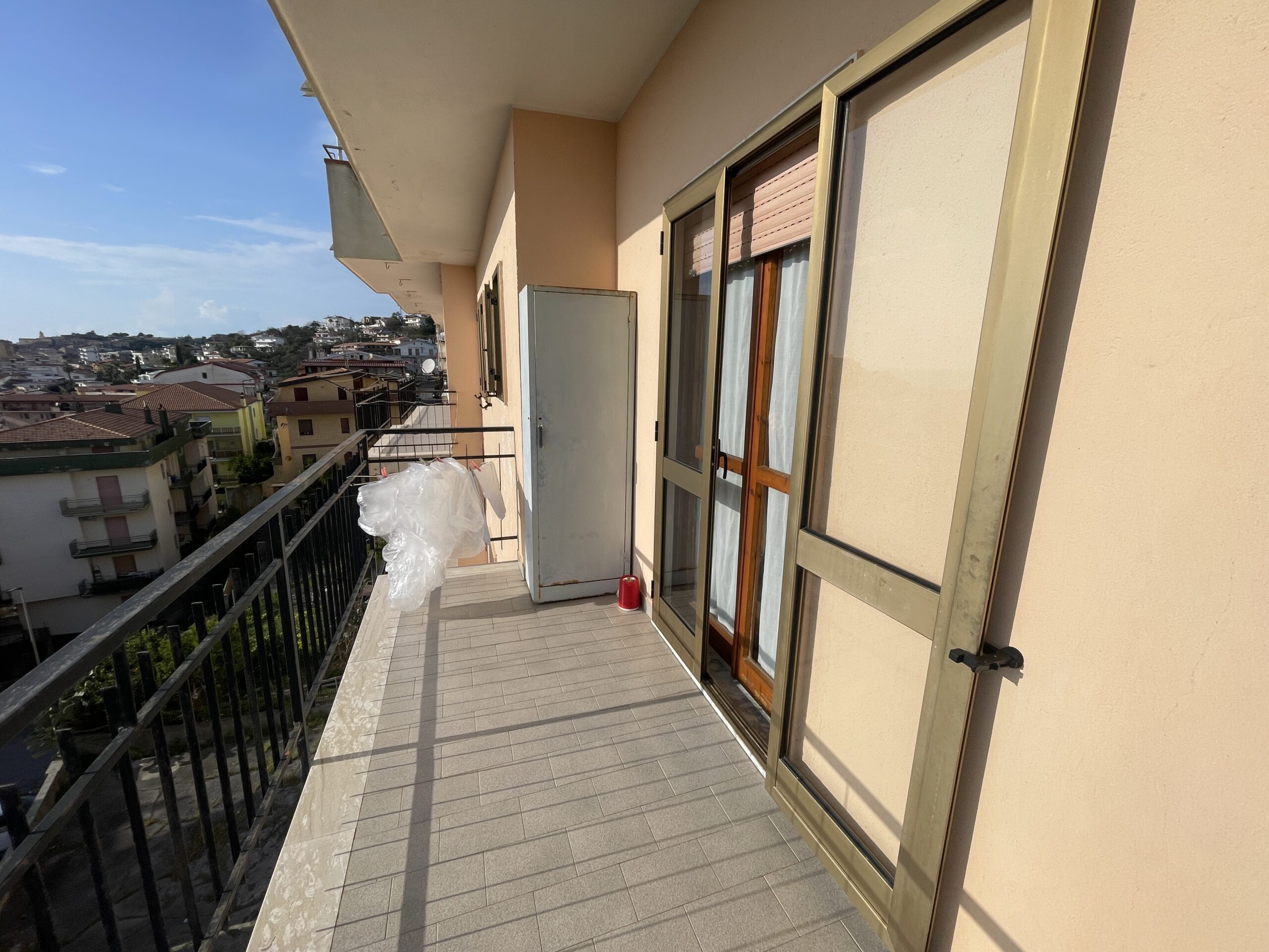 A flat with large panoramic balcony.