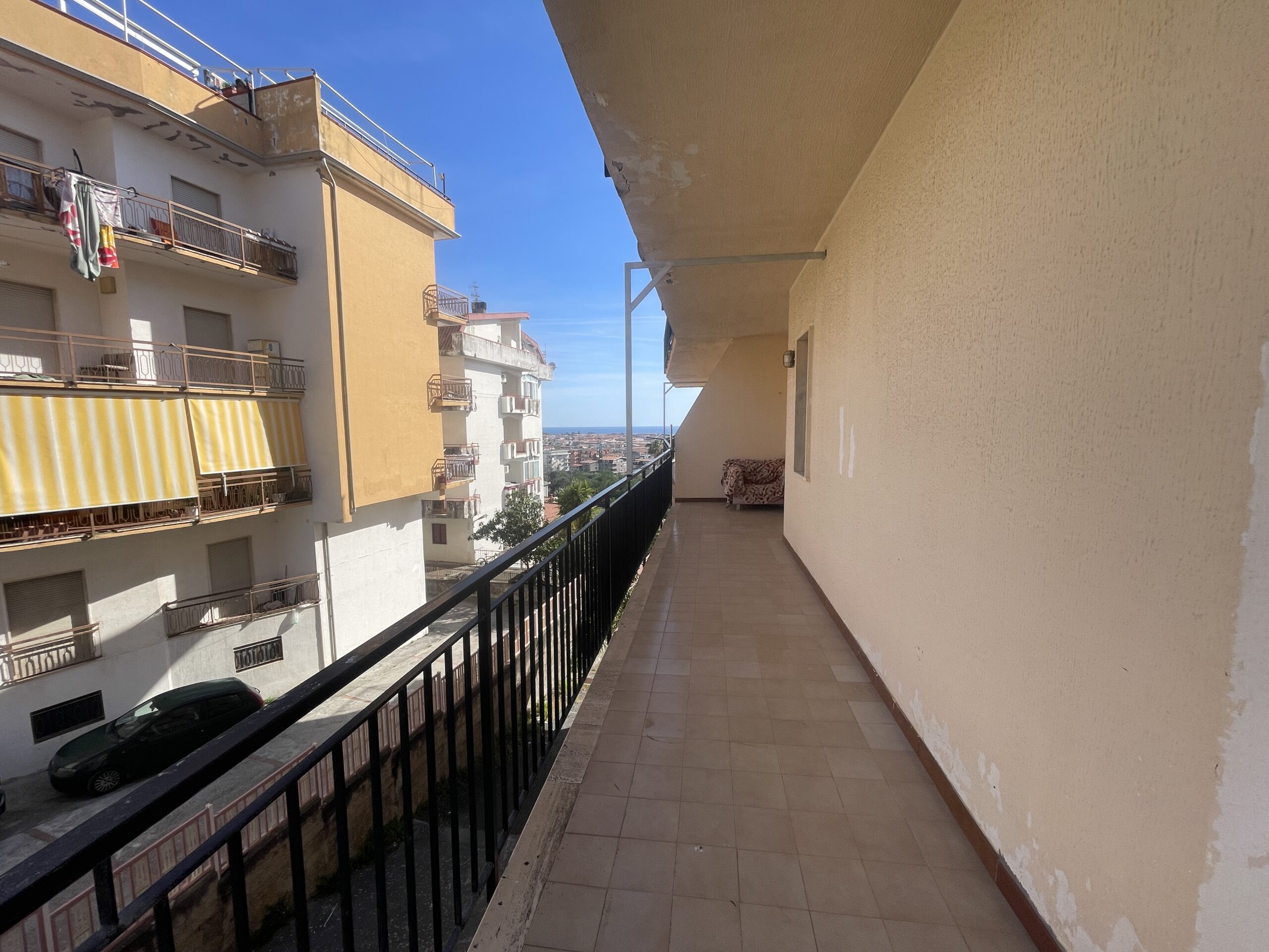 A spacious flat with a balcony overlooking the sea and a large terrace
