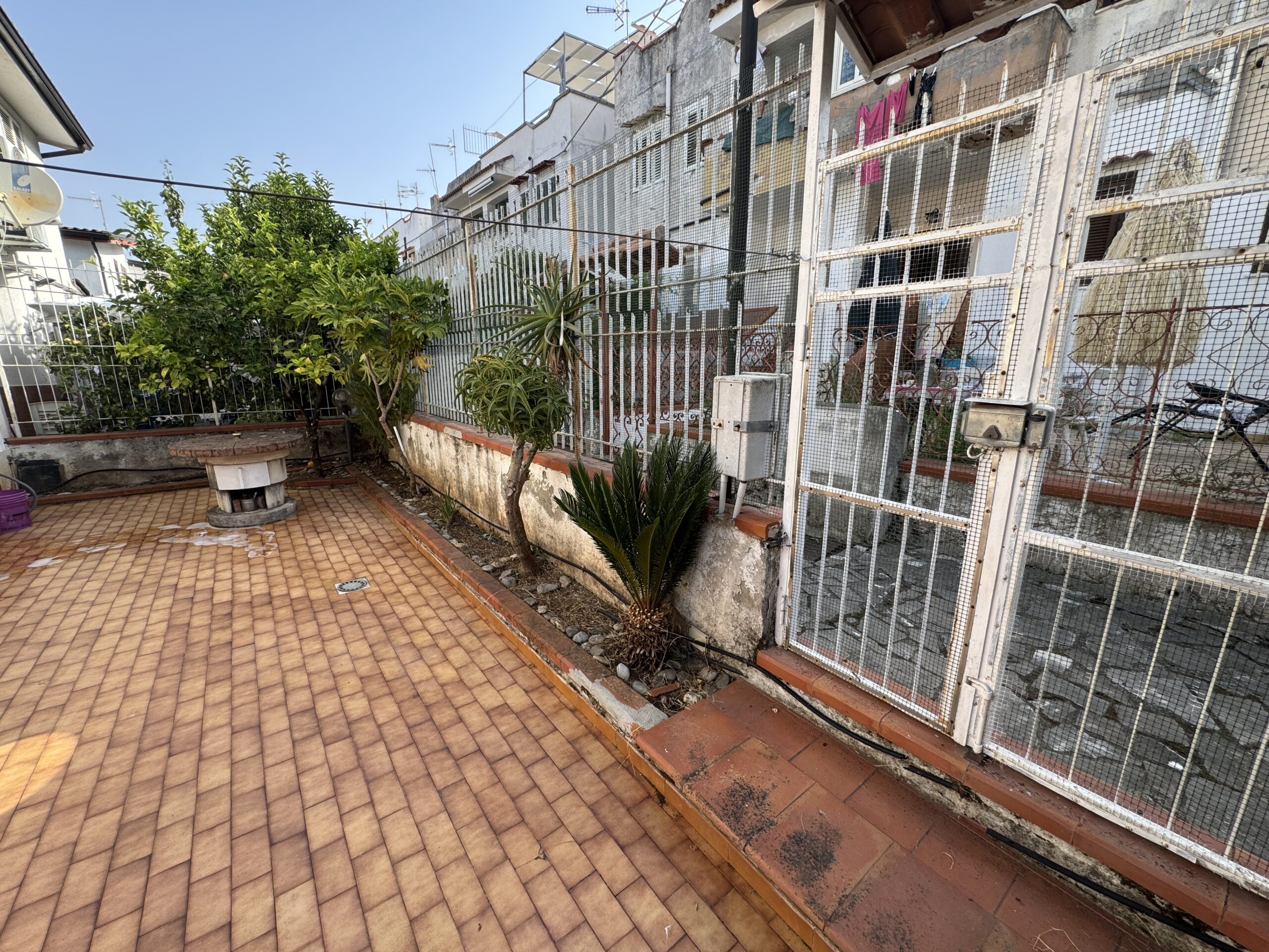 A two-storey house with a spacious garden