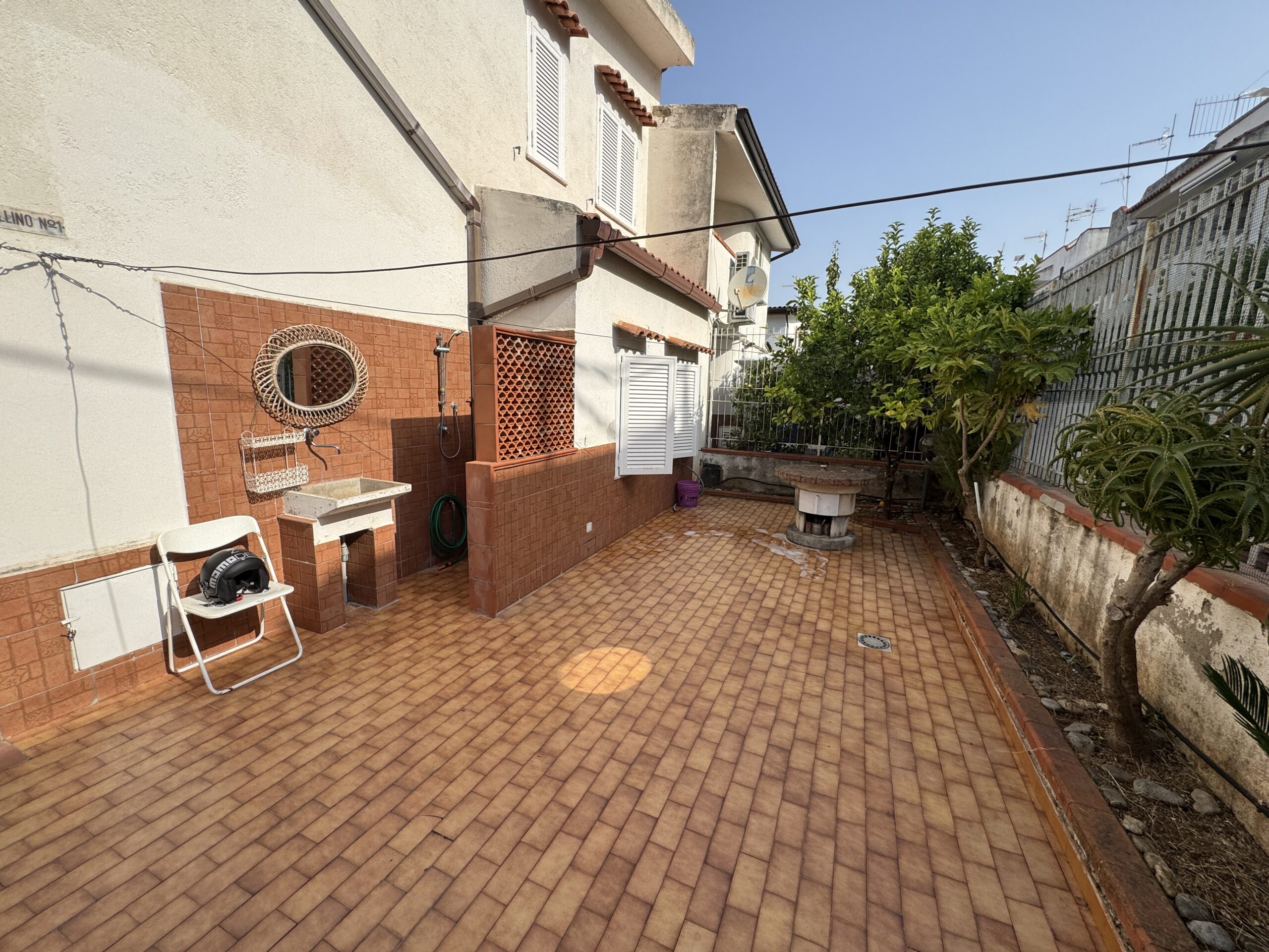 A two-storey house with a spacious garden