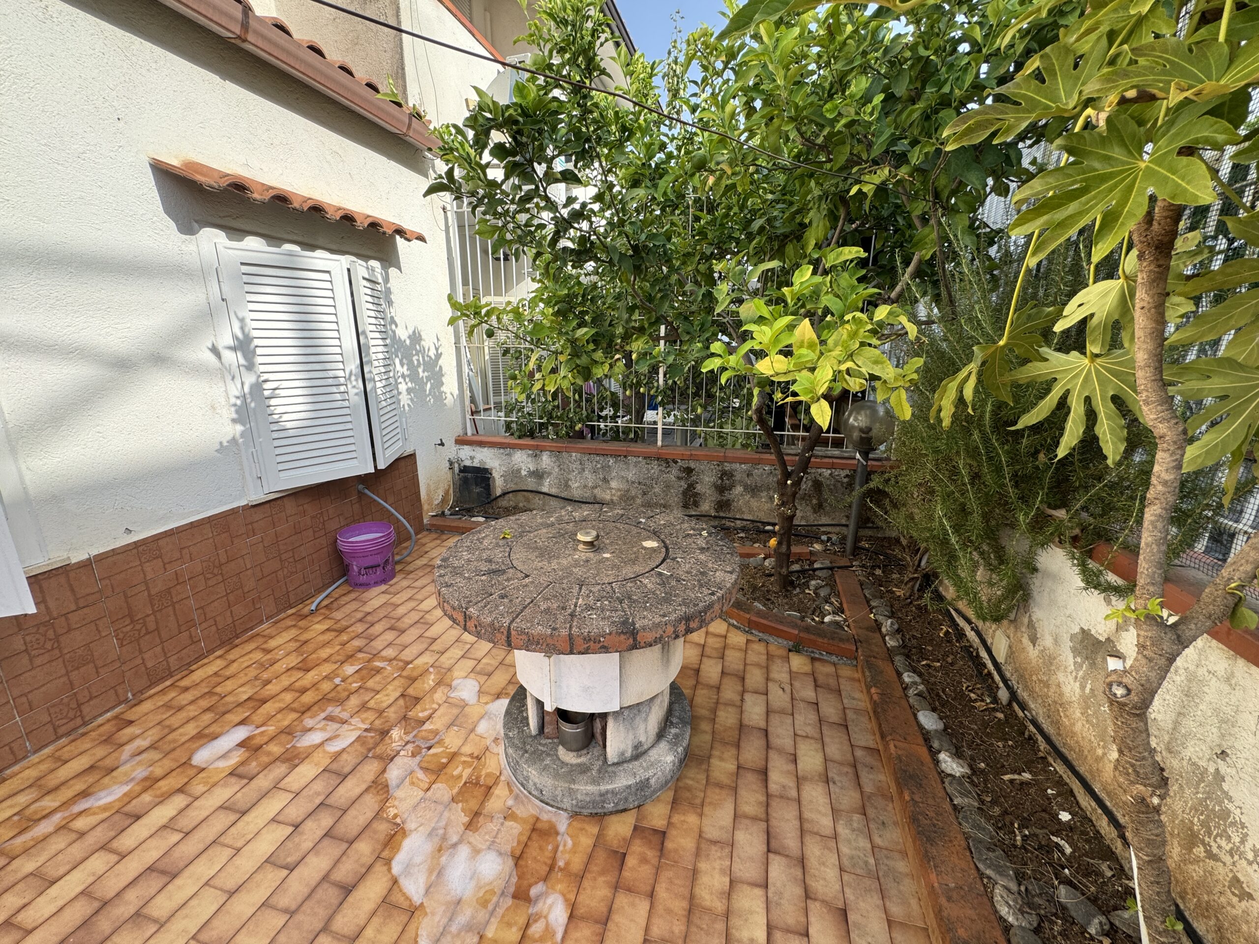 A two-storey house with a spacious garden