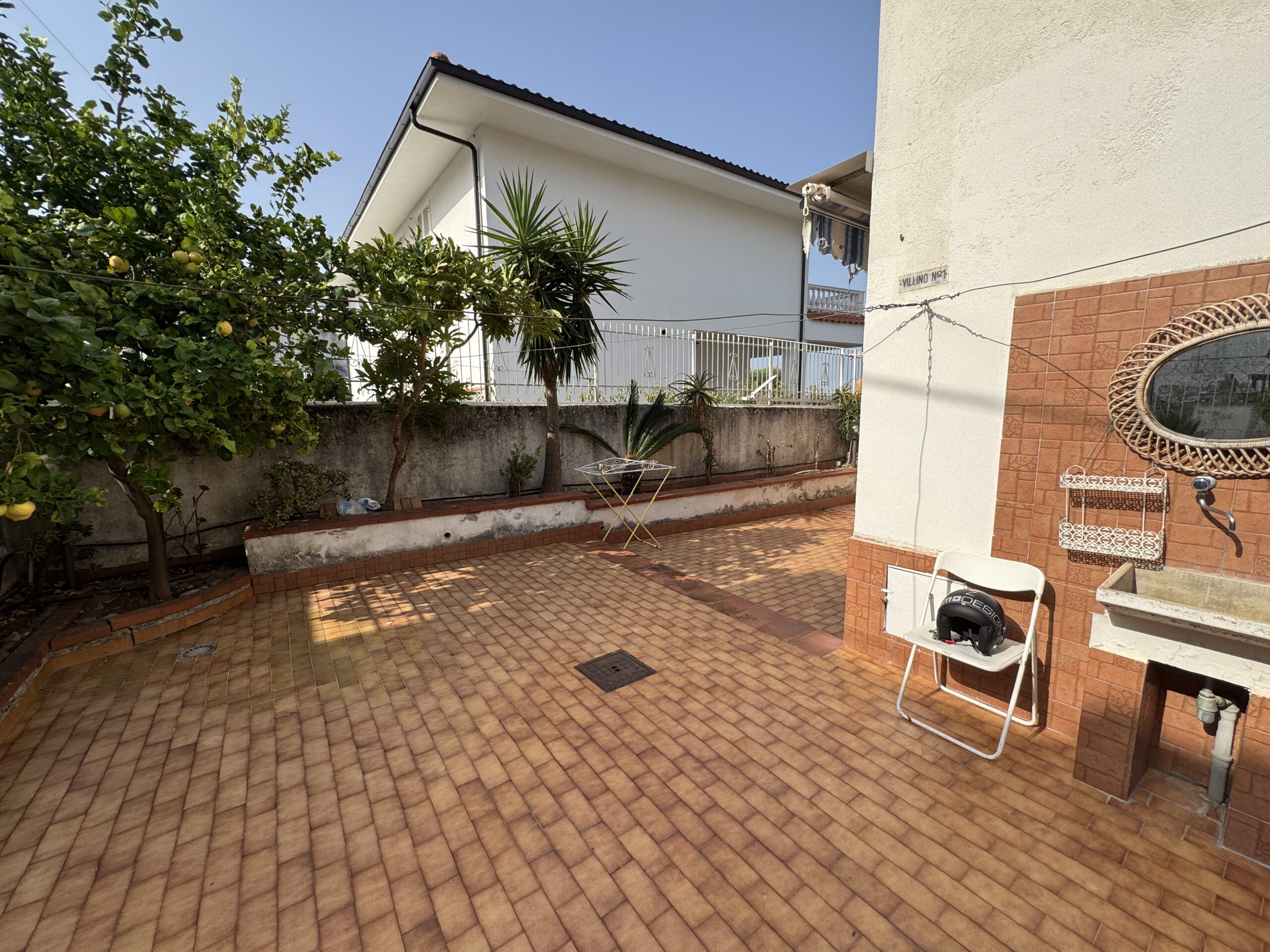 A two-storey house with a spacious garden