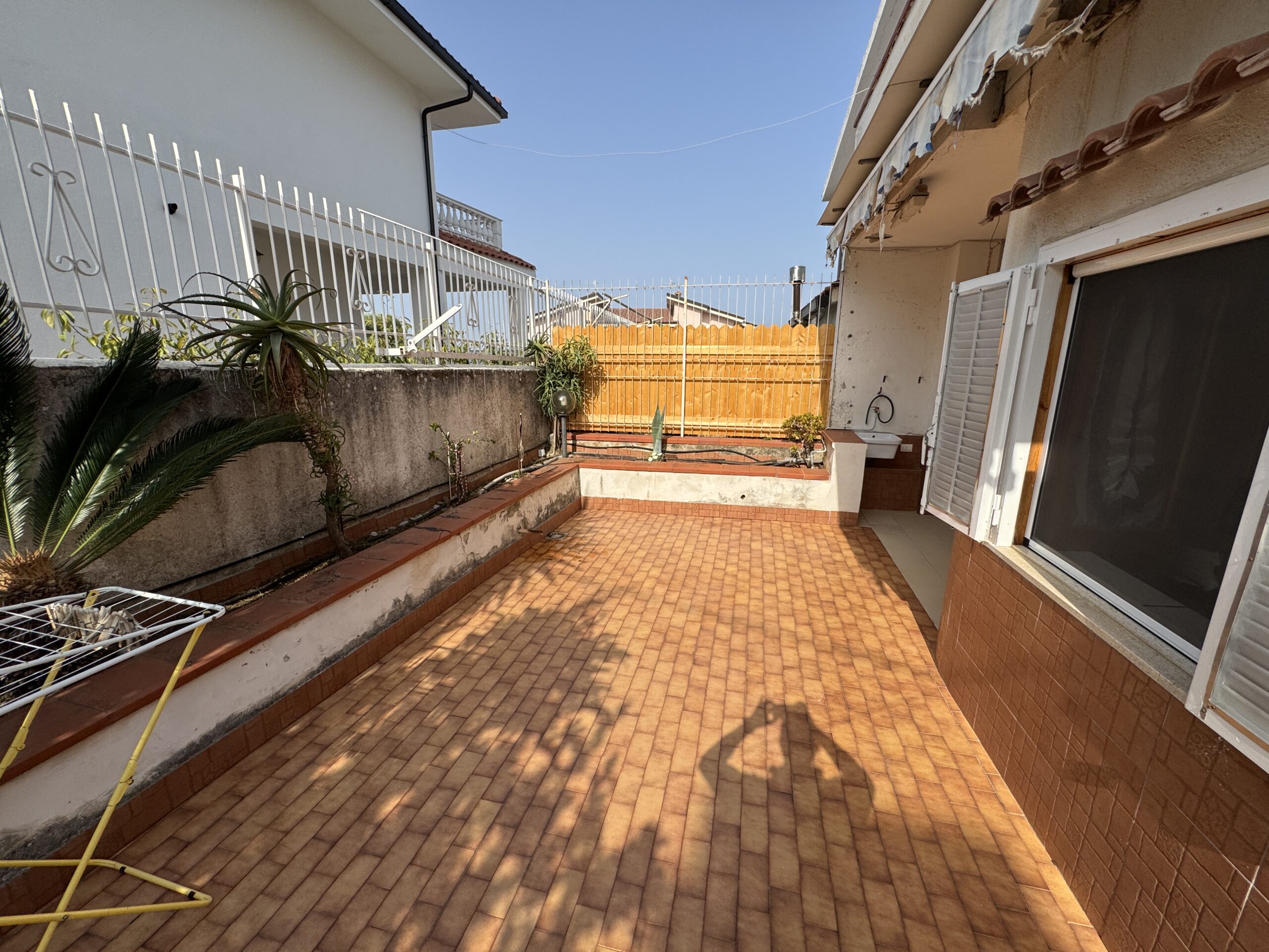 A two-storey house with a spacious garden