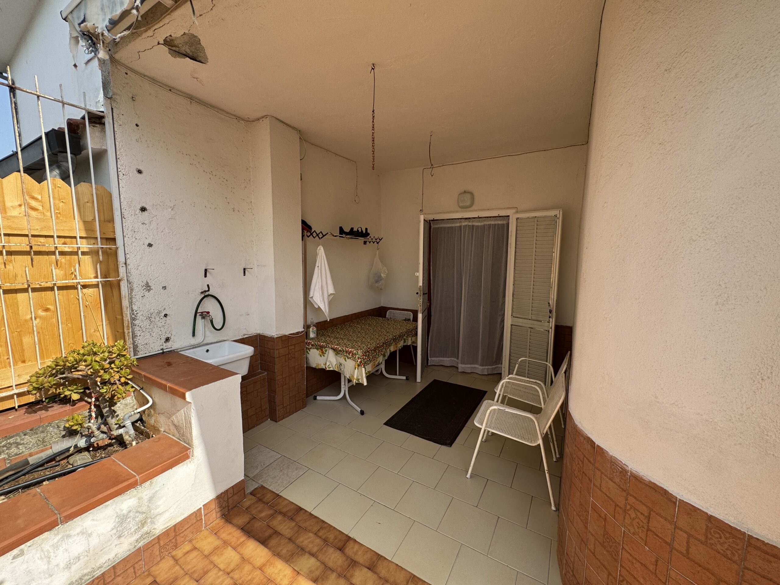 A two-storey house with a spacious garden