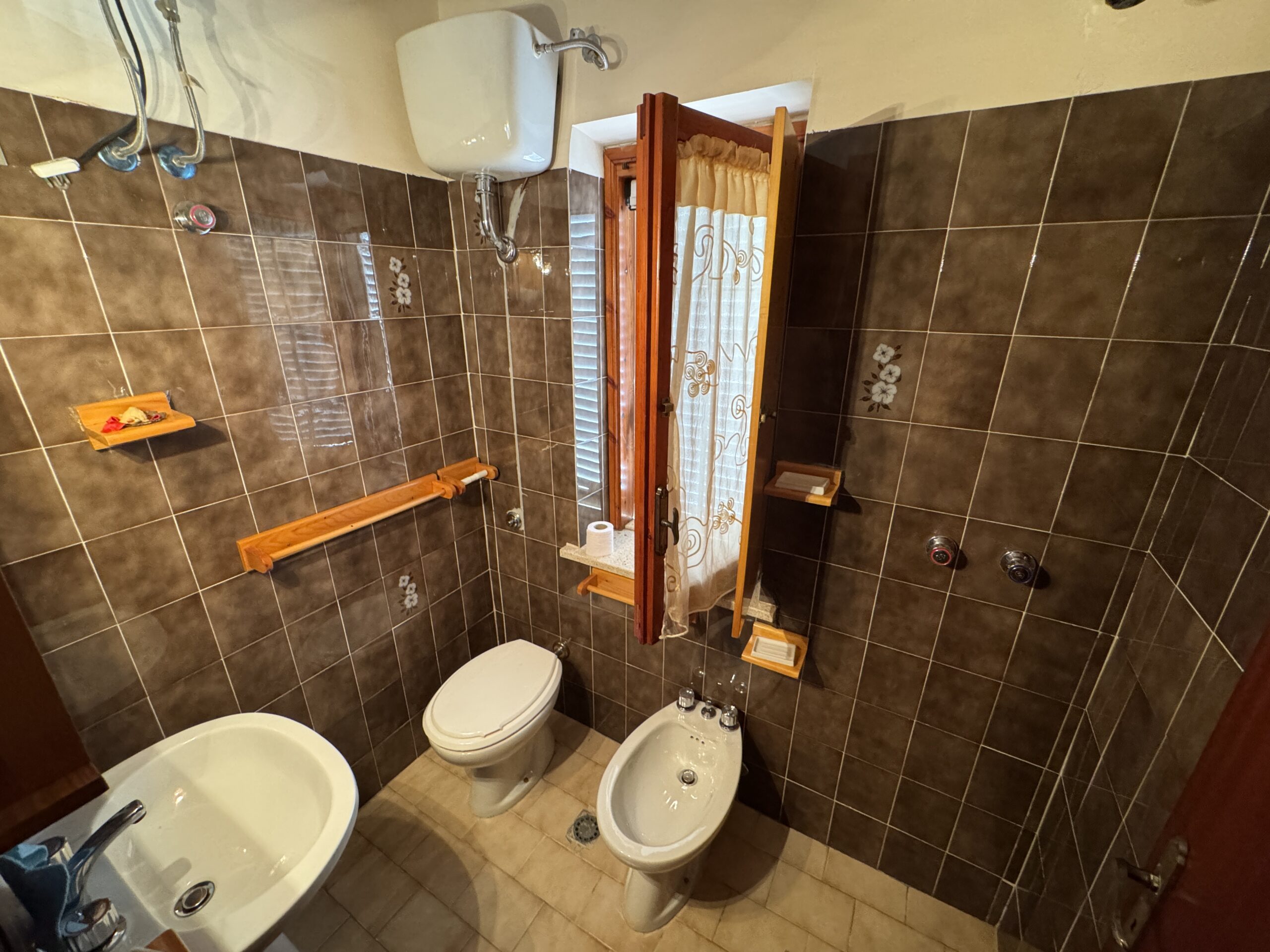 A two-storey house with a spacious garden