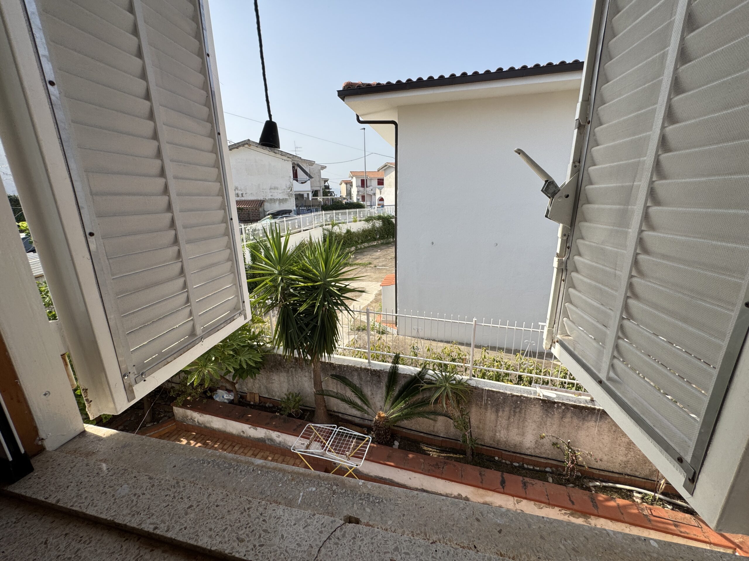 A two-storey house with a spacious garden