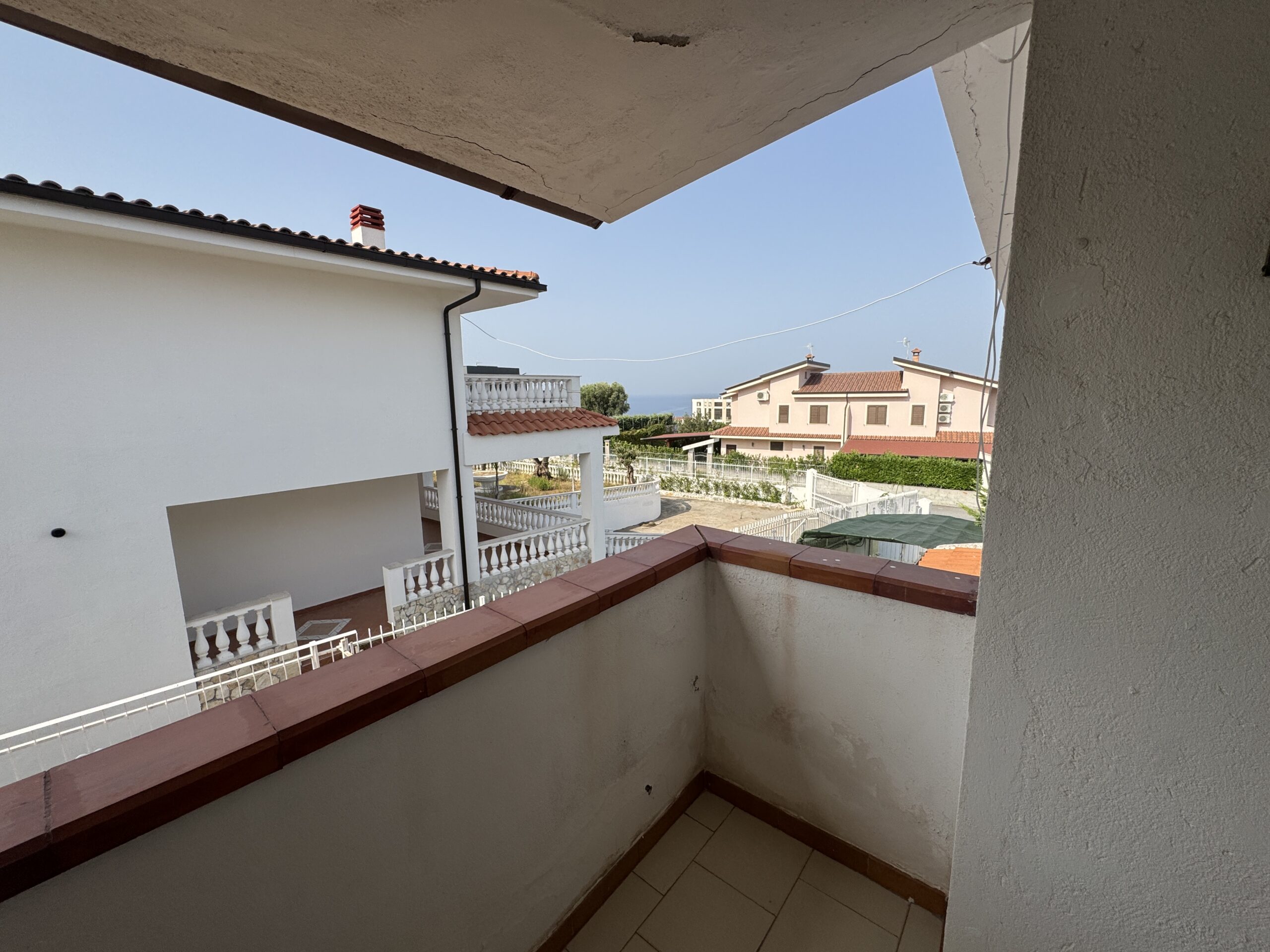 A two-storey house with a spacious garden